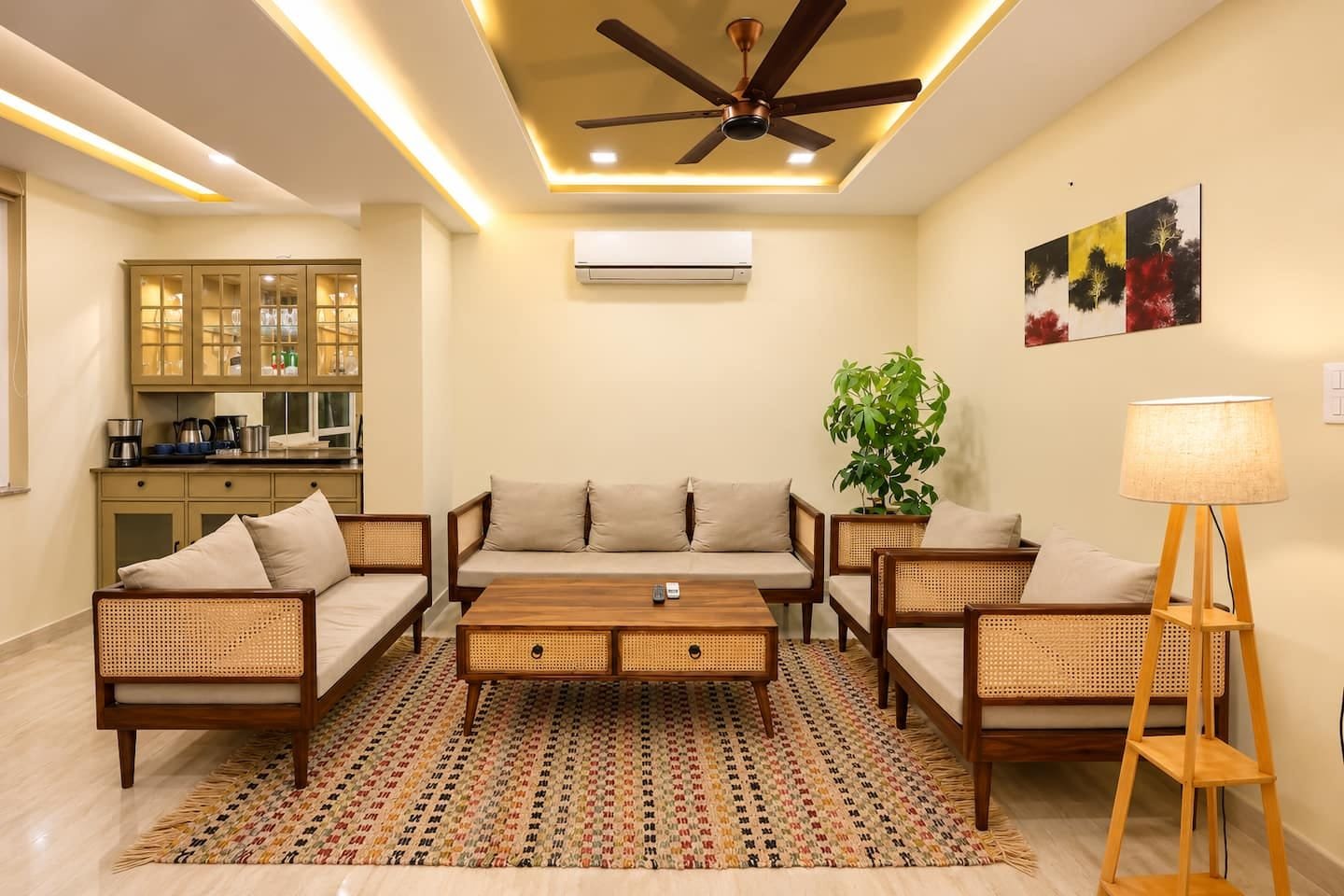 Seating area with cane sofas, a wooden coffee table and a floor lamp