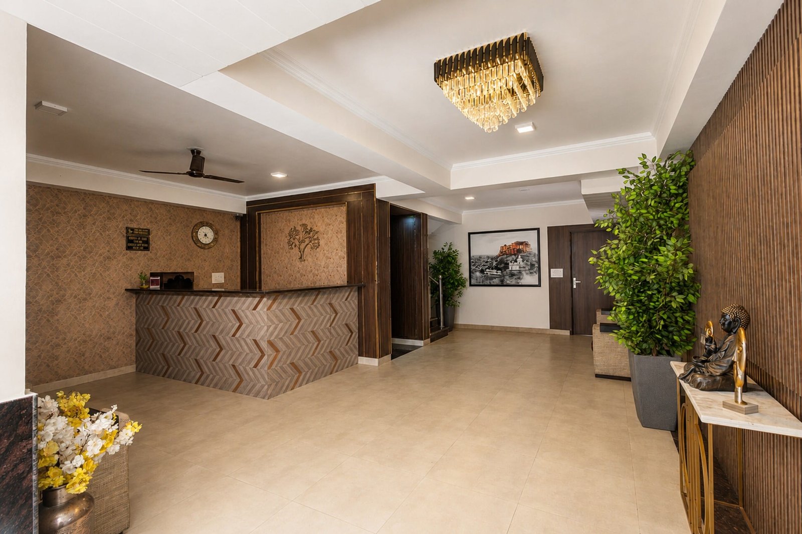 Reception desk with a herringbone front under a crystal chandelier
