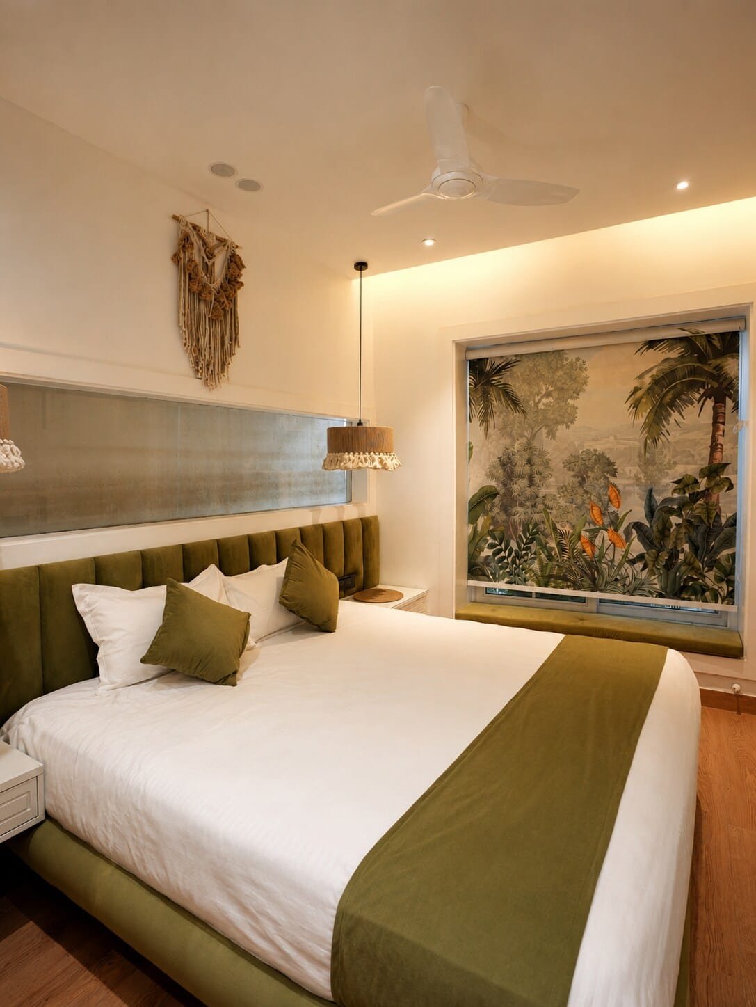 Bedroom with an olive bed runner and a jungle-print mural