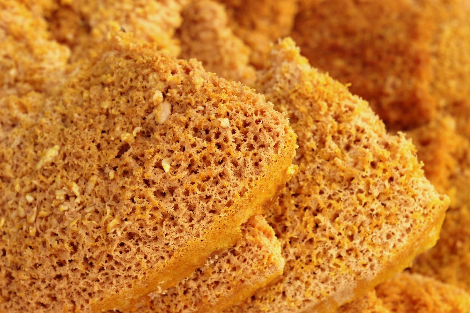 Close view of ghevar, a round honeycombed sweet